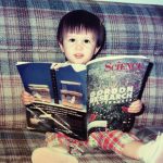 The author reading a science magazine as a child.
