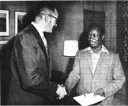 Photo of two men shaking hands